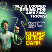 Young man using glowing green ZipString toy with magical floating string effects in dark setting