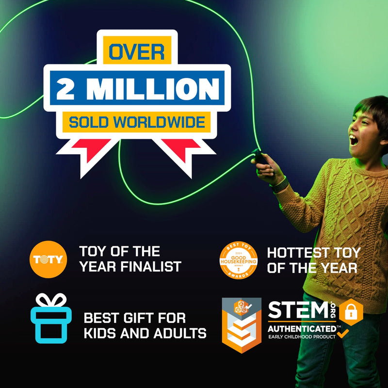 Child playing with ZipString Luma toy showing green light effects and product awards