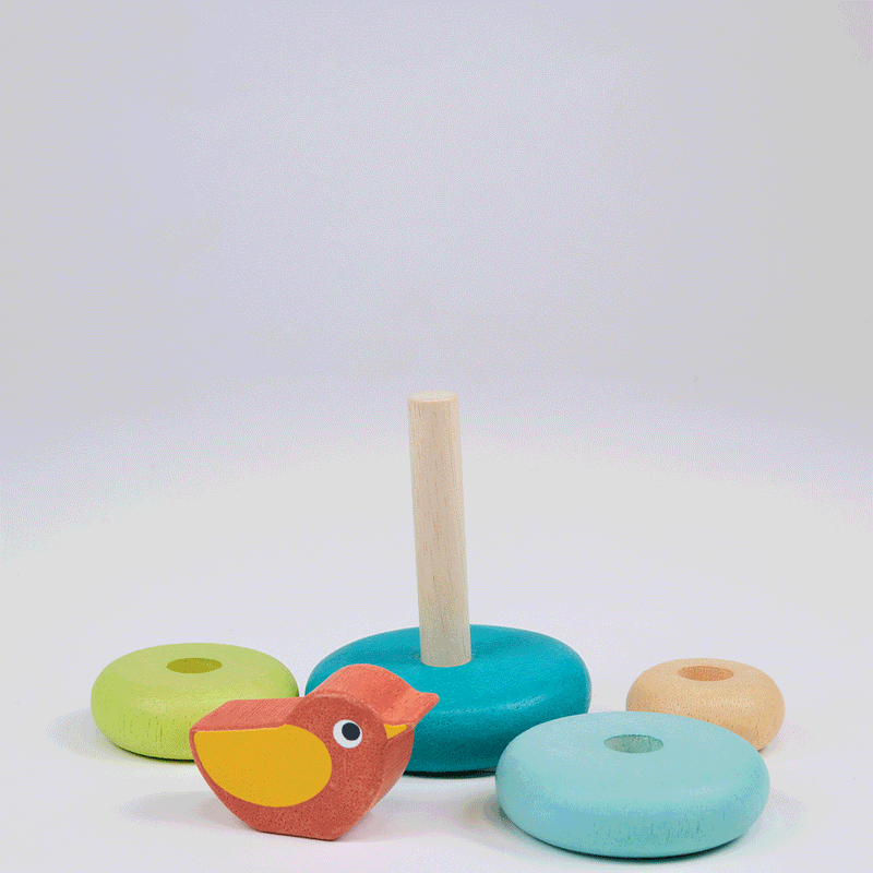 Colorful wooden stacking toy with bird featuring rings in green, blue, orange, and natural wood tones