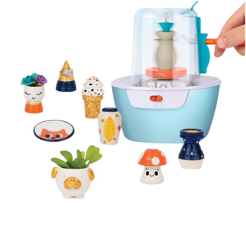 Kids pottery wheel kit with various small ceramic figures around it on a white background
