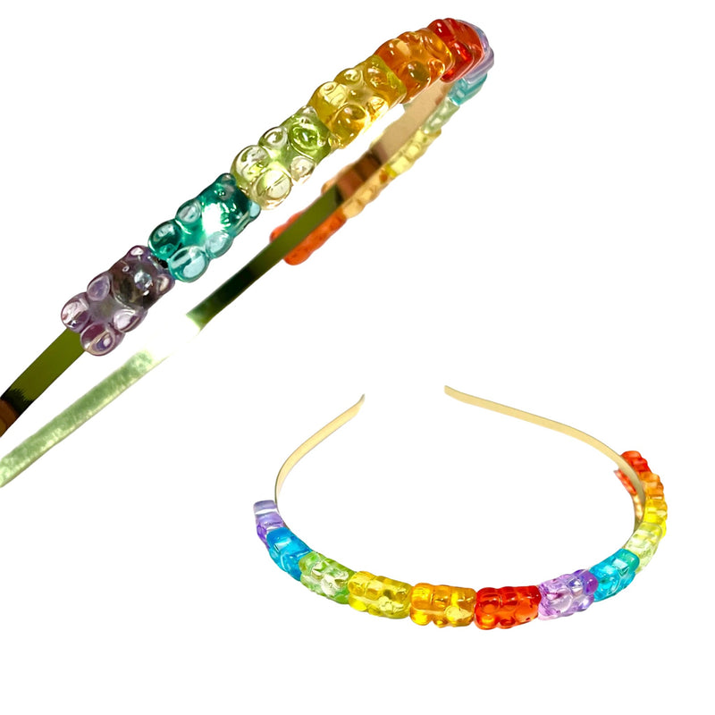 Closeup of a headband with a translucent rainbow gummy bear beads on a white background, one shown at an angle and one as a straight-on front view.