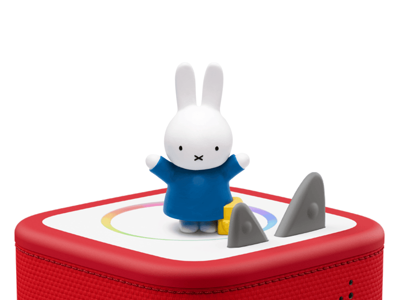 Miffy character figure in blue outfit on red Toniebox speaker with accessories