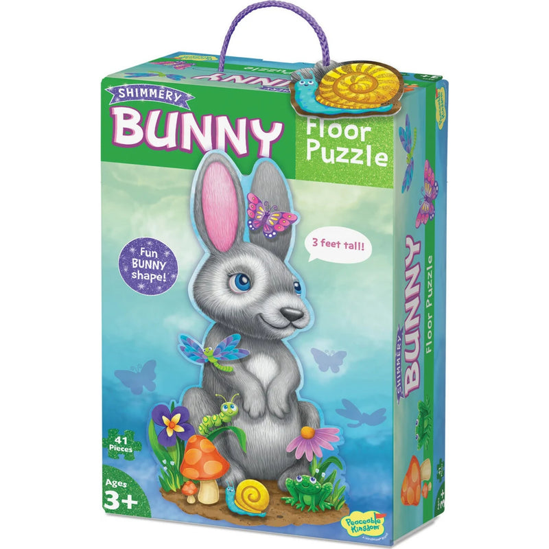 Shimmery Bunny Floor Puzzle box by Braindead Toys, featuring a colorful cartoon bunny illustration on the front with a purple carrying handle and product title.