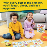Two children playing with a game called 'Plunger Pop' on the floor.