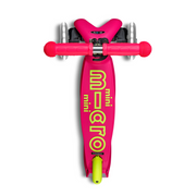 Mini Micro Deluxe Foldable LED scooter in neon flamingo pink with yellow-green branding, top-down view