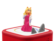 Miss Piggy Tonie figure in pink dress and white coat on red Toniebox speaker