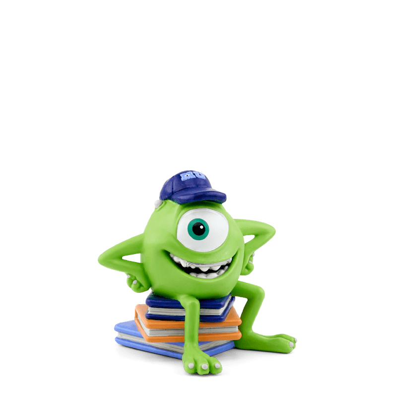 Green one-eyed Mike Wazowski Tonie figurine with blue cap sitting on colorful books