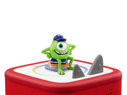Green one-eyed Mike Wazowski Tonie figure with blue cap on red Toniebox speaker