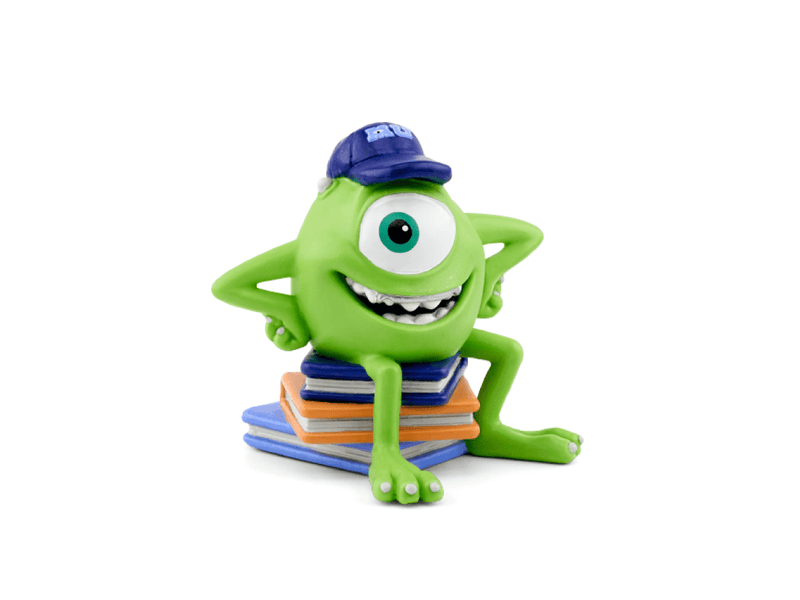 Green one-eyed Mike Wazowski Tonie figure with blue hat sitting on colorful books