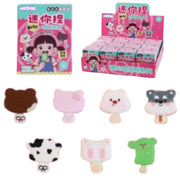 A display of cute, small novelty items in pink packaging, including character-themed mini bags and several individual pastel-colored plush or foam accessories shaped like a bear, Hello Kitty, a cat face, a raccoon, a cow, and a green bear on a white background.