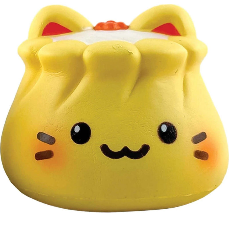 A yellow cat-shaped squishy toy with a cute cartoon face, black eyes, a wavy smile, and orange inner ears, isolated on a white background.