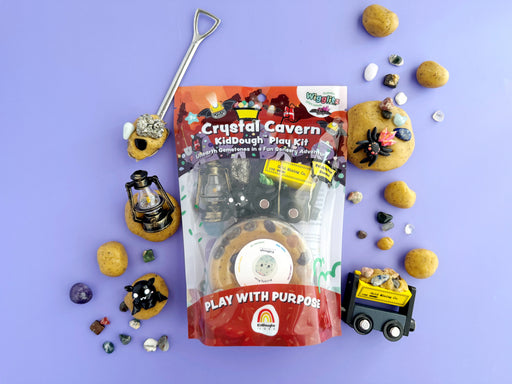 Crystal Cavern KidDough play kit with mining tools and gemstones on purple background