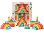 Kipod rainbow and geometric blocks toy set, showing the colorful wooden arches, triangle towers, rectangular blocks, and small peg dolls both arranged in front of and inside their patterned packaging box on a white background.