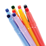 Four colorful double-ended markers with decorative heart and star patterns on black background