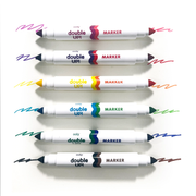 Six OOLY Double Up! double-ended markers with different color combinations on white background