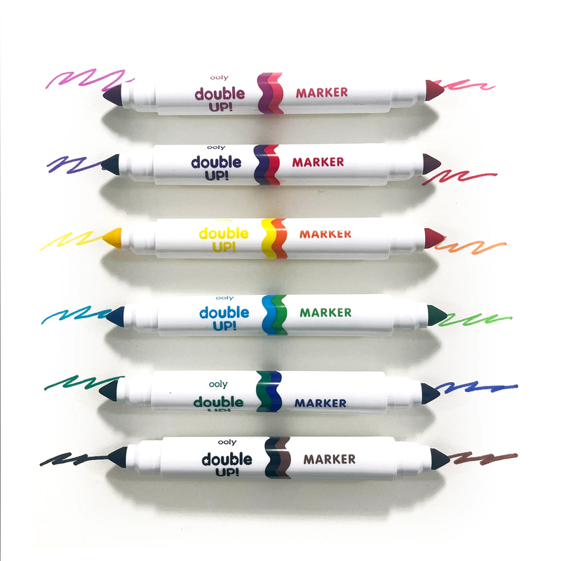 Six OOLY Double Up! double-ended markers with different color combinations on white background