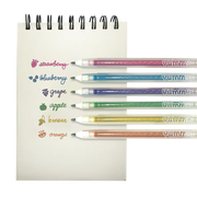 Six colorful scented gel pens with fruit names and corresponding colored ink displayed on notepad