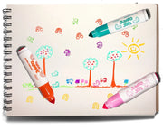 Three Jumbo Dot Kids dry-erase markers in orange, teal, and pink, laid on top of a spiral-bound children's drawing pad that shows colorful scribbled artwork.