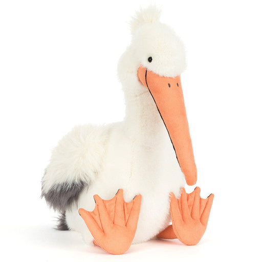 White fluffy pelican plush toy with orange beak and webbed feet
