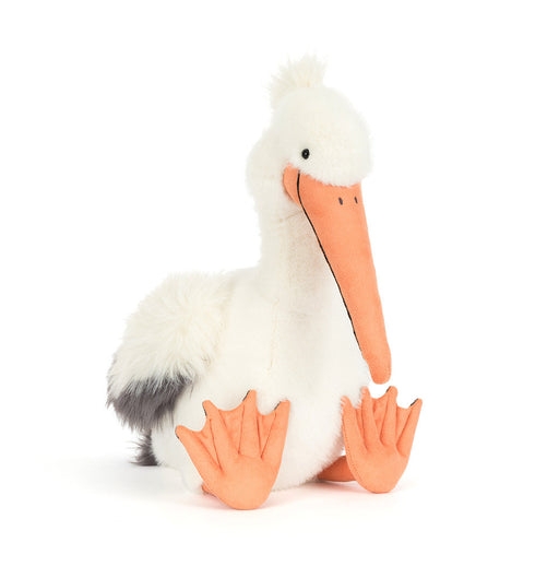 White fluffy pelican plush toy with orange beak and webbed feet