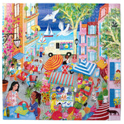 Completed 1000-piece jigsaw puzzle showing vibrant French marketplace scene with people shopping