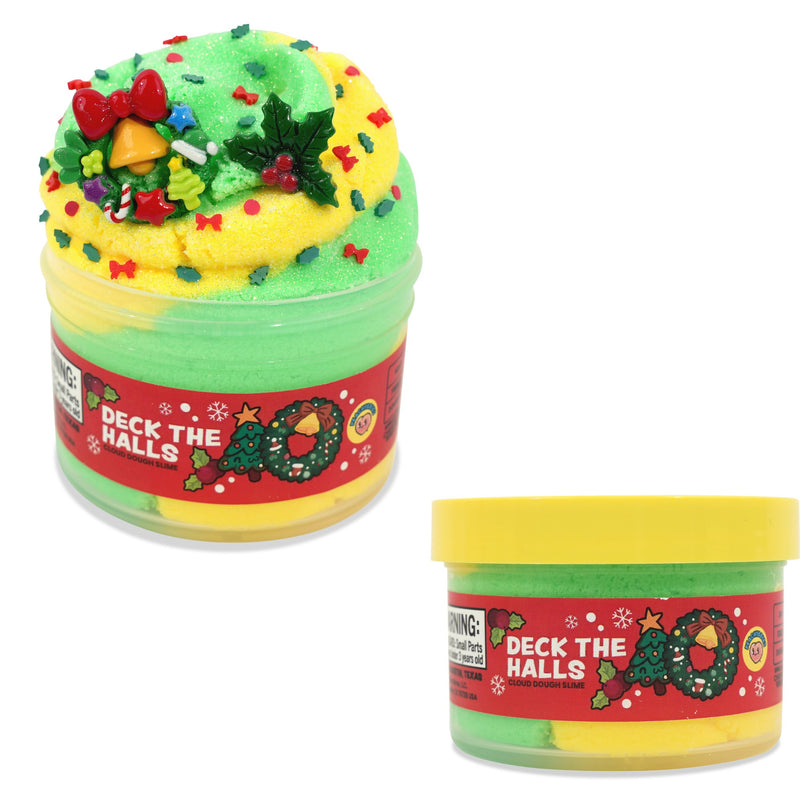 Peachybbies slime on a white background, one large open jar topped with a yellow slime swirl decorated with green holly leaves, red bows, and colorful sprinkles, and one smaller closed jar with a yellow lid and a red label reading 'Deck the Halls.'.