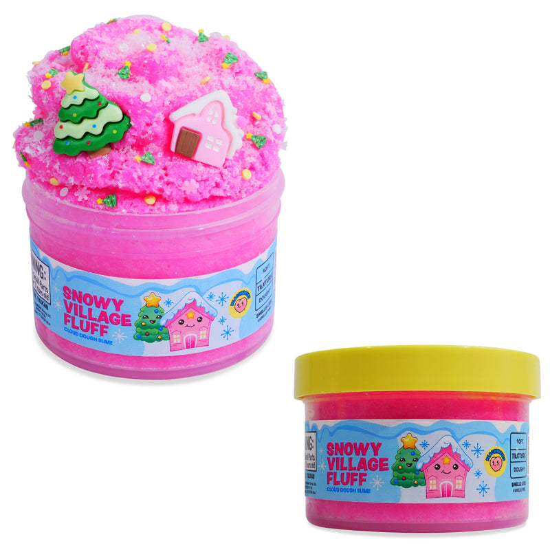 Peachybbies 'Snowy Village Fluff' slime on a white background, one large decorated with a green Christmas tree and pink house, and one smaller tub with a yellow lid.