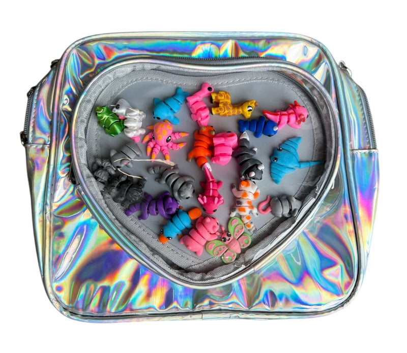 Holographic heart-shaped bag open revealing colorful collectible toys inside