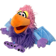 Purple furry puppet with pink hair, orange beak, and blue wings on white background