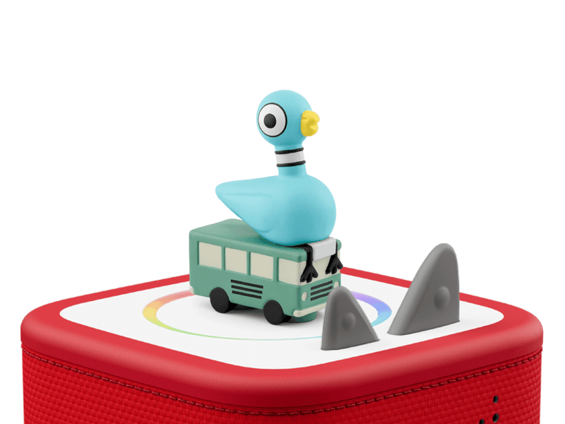 Blue pigeon character Tonie figure on green bus sitting on red Toniebox with gray obstacles