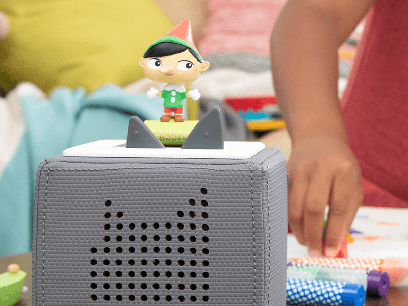 Tonie elf character figure on Toniebox audio player in child's playroom setting