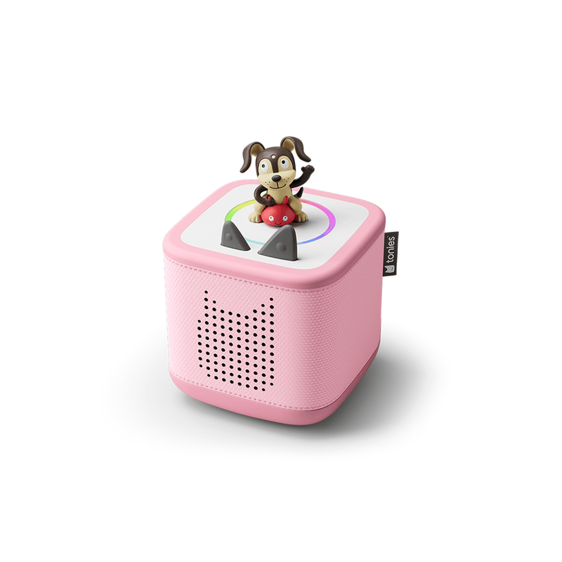 Pink TonieBox audio player with cartoon dog character on top on white background