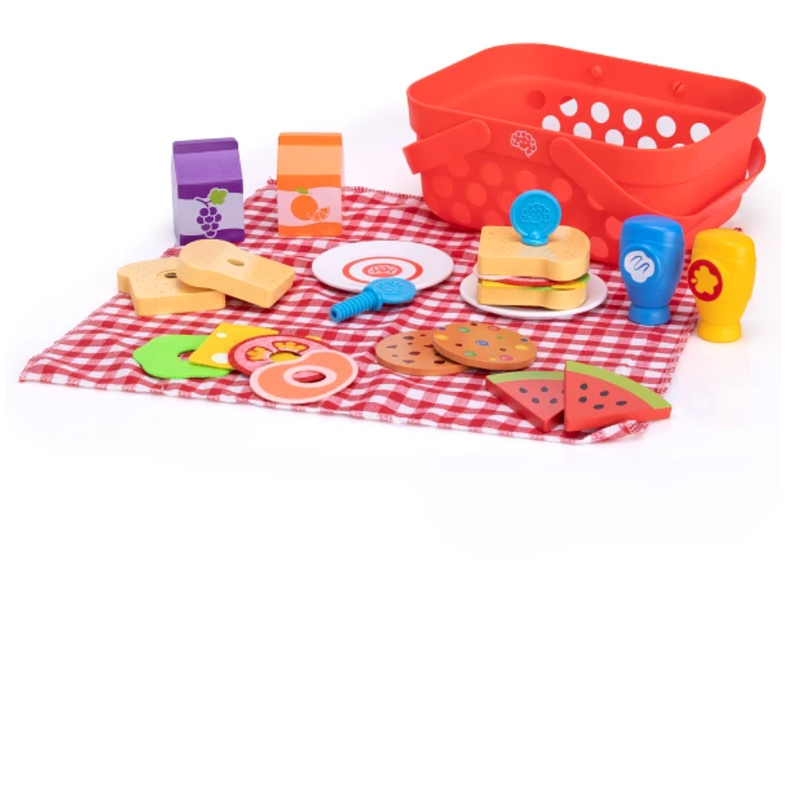 Colorful toy picnic set with a red basket, plates, and food items on a checkered cloth.