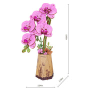 Decorative purple orchid with a vase on a white background