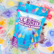 Packaging of Lil' Bursts Mini Bath Bombs with colorful bath bombuds in the background.