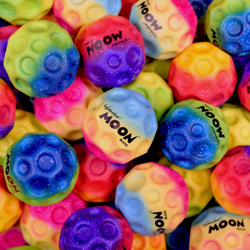 Multiple colorful gradient Waboba Moon Balls with crater texture in various rainbow colors.