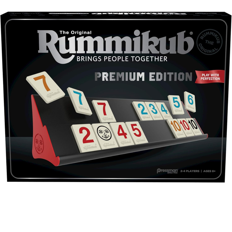 Rummikub premium edition packaging with tiles and stand on a dark background