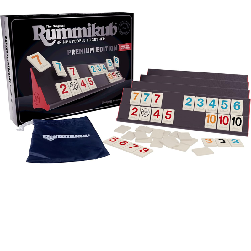 Rummikub premium edition game set with tiles and packaging on a white background