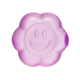 Purple translucent flower-shaped squishy toy with smiley face design on white background