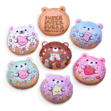 Collection of colorful bear-shaped donut squishy toys with sprinkle designs and kawaii faces