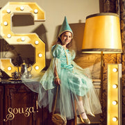 Girl wearing mint green Victoria princess dress with tulle layers and matching hat