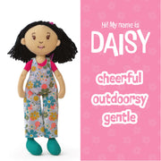 Doll with floral overalls on a pink background with text about the doll named Daisy.