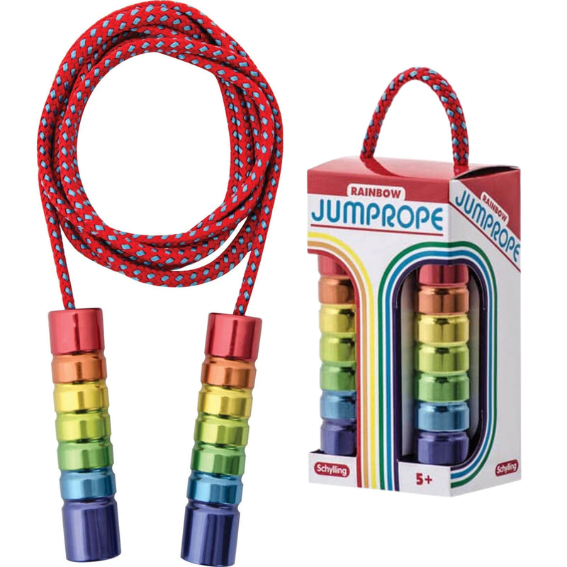 A rainbow-themed jump rope with a red and blue patterned cord and metallic rainbow-colored handles, shown next to its retail packaging box on a white background.