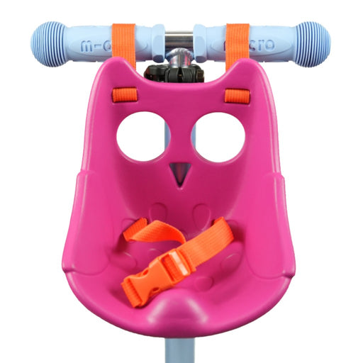 Pink owl-shaped Scootaseatz with orange straps attached to scooter handle bars on a white background