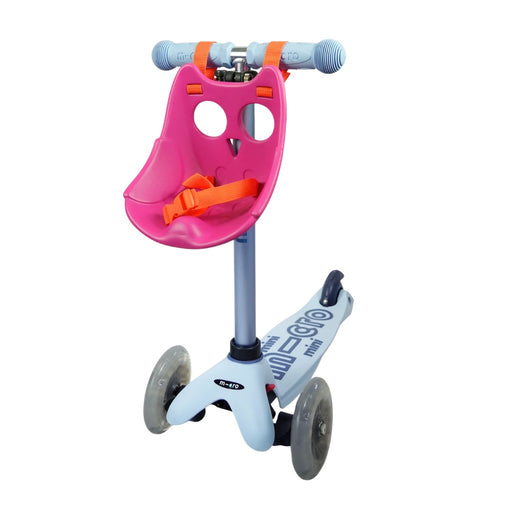 Children's scooter with a pink Scootaseatz and orange straps on a white background