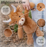 Brown Highland cow plush toy held by person with feature callouts