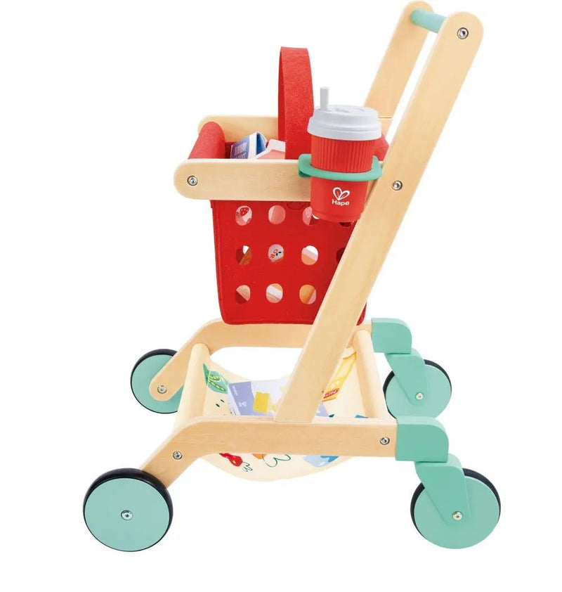 Wooden toy shopping cart by Hape with red basket and mint green wheels