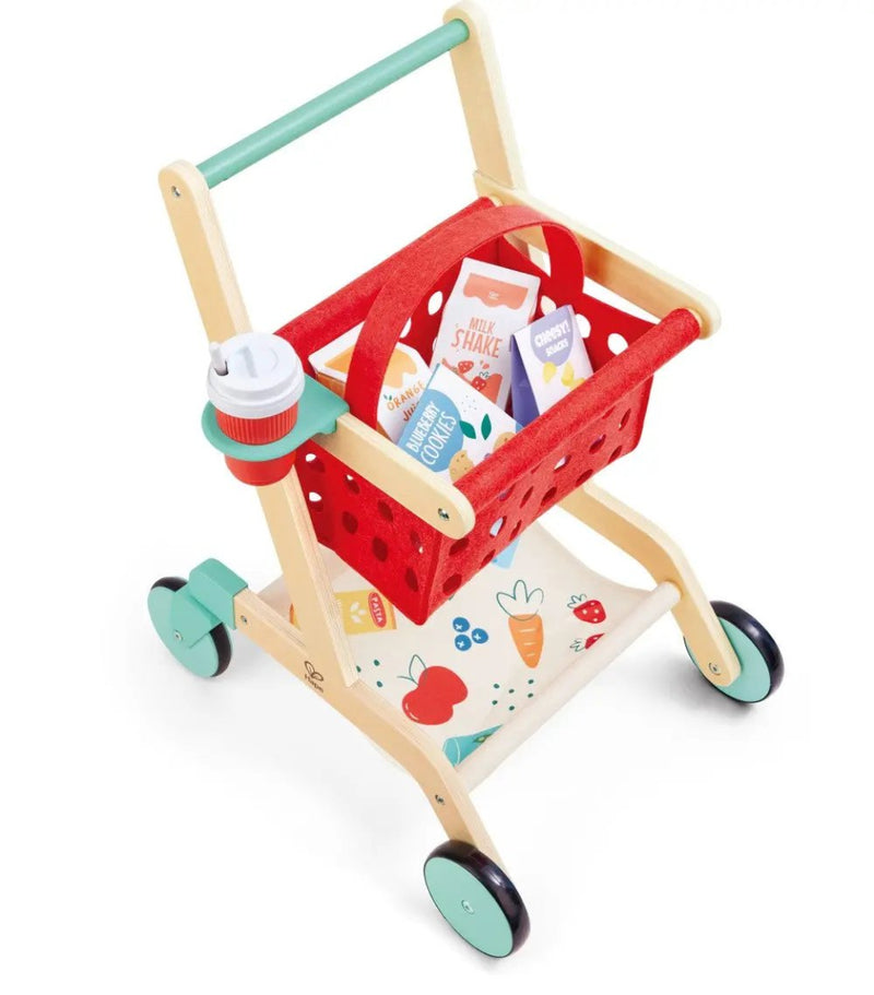 Wooden toy shopping cart with red fabric basket containing play food items