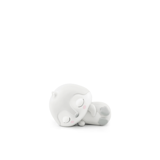 White sleeping penguin Tonie audio figure lying on side with closed eyes