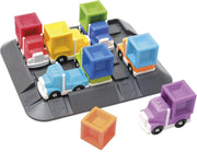 Game board from Express Courier game featuring  toy delivery trucks with matching cargo blocks on a gray play mat, photographed on a clean white background. 